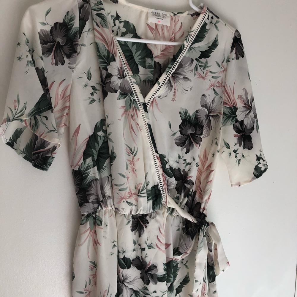 White floral top with tie at the waist size medium